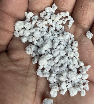 An image of Perlite in hand that is used in potting soil
